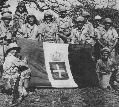 South African forces - forming an important part of the British forces in the 1940-1941 East Africa Campaign - with a captured Italian flag
