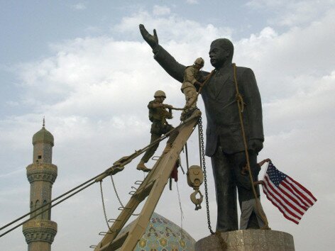 United States troops prepare to pull down a statue of Iraqi president Saddam Hussein.