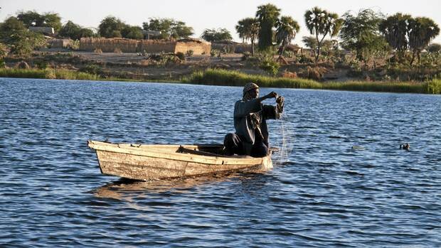 A fisherman on Lake Chad. Lake Chad has since the 1960's been greatly reduced in size through irrigation projects tapping from the feeding rivers and long periods of drought in the Sahel.